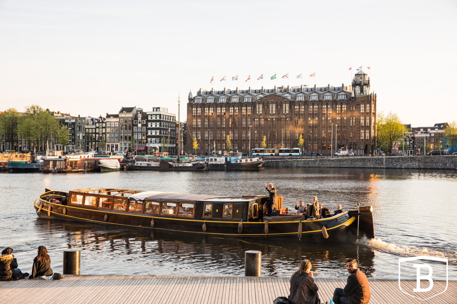 Client drinks on a boat during Amsterdam Light Festival